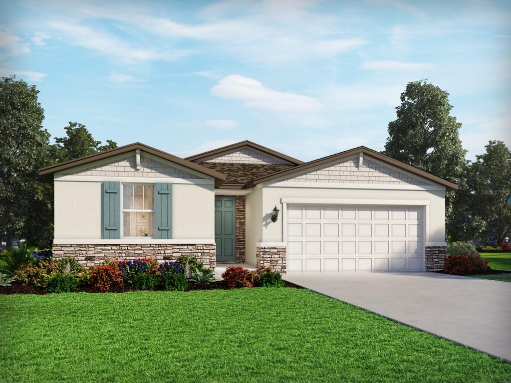 2069 Rosewood Dr, Bartow, FL 33830 - single story home featuring stone siding, driveway, an attached garage, and a front yard