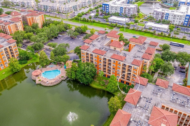 12527 Floridays Resort Dr Unit E104, Orlando, FL 32821 - bird's eye view of a pool area and a nearby body of water