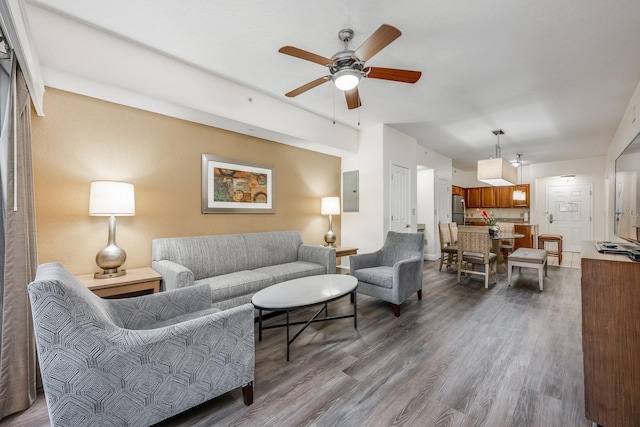 12527 Floridays Resort Dr Unit E104, Orlando, FL 32821 - living area featuring a ceiling fan, dark wood-style floors, and electric panel