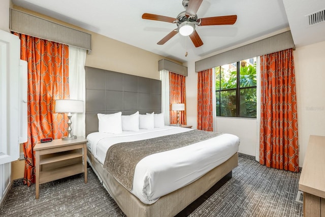12527 Floridays Resort Dr Unit E104, Orlando, FL 32821 - bedroom featuring carpet and a ceiling fan