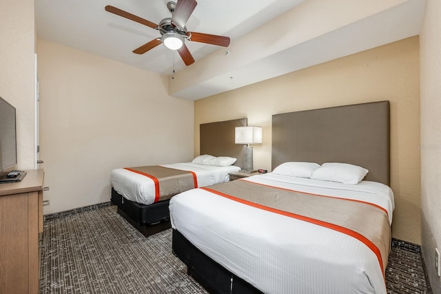 12527 Floridays Resort Dr Unit E104, Orlando, FL 32821 - bedroom featuring dark colored carpet and a ceiling fan