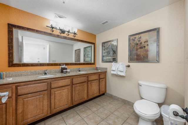 12527 Floridays Resort Dr Unit E104, Orlando, FL 32821 - bathroom with double vanity and tile patterned flooring