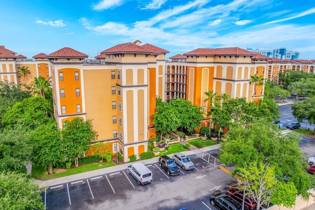 12527 Floridays Resort Dr Unit E104, Orlando, FL 32821 - view of property with uncovered parking