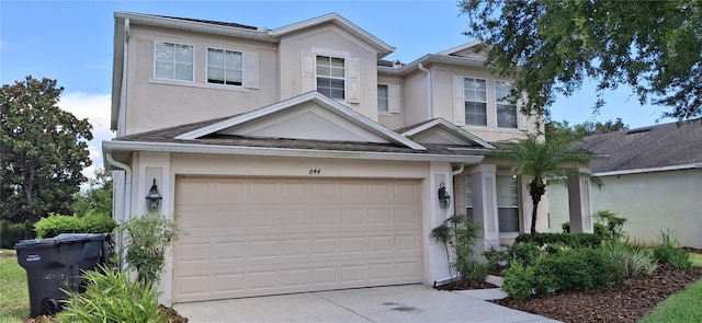 844 Suffolk Pl, Davenport, FL 33896 - traditional home featuring stucco siding, driveway, and an attached garage