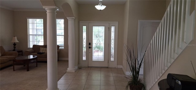 844 Suffolk Pl, Davenport, FL 33896 - foyer featuring decorative columns, crown molding, light tile patterned flooring, and arched walkways