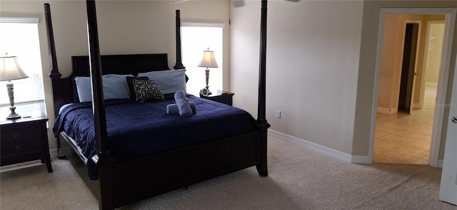 844 Suffolk Pl, Davenport, FL 33896 - bedroom featuring carpet, multiple windows, and connected bathroom