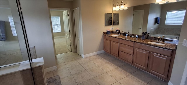 844 Suffolk Pl, Davenport, FL 33896 - full bathroom with double vanity, tile patterned floors, a bath, and a shower with door