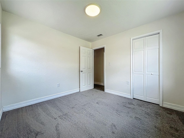 2109 Hartwell Ave, Sanford, FL 32771 - unfurnished bedroom with carpet floors and a closet