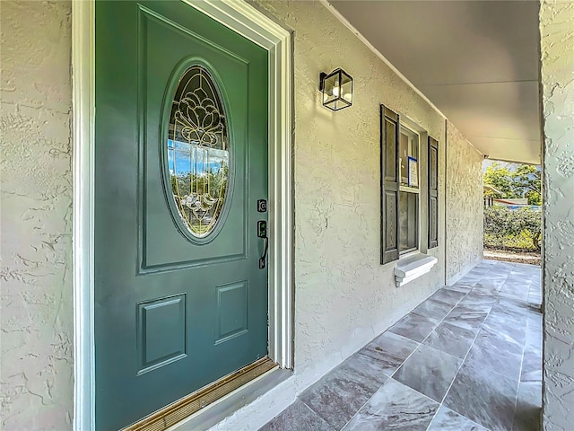 2109 Hartwell Ave, Sanford, FL 32771 - entrance to property with a porch and stucco siding