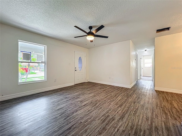 2109 Hartwell Ave, Sanford, FL 32771 - entryway with dark wood-type flooring, a textured ceiling, and a ceiling fan