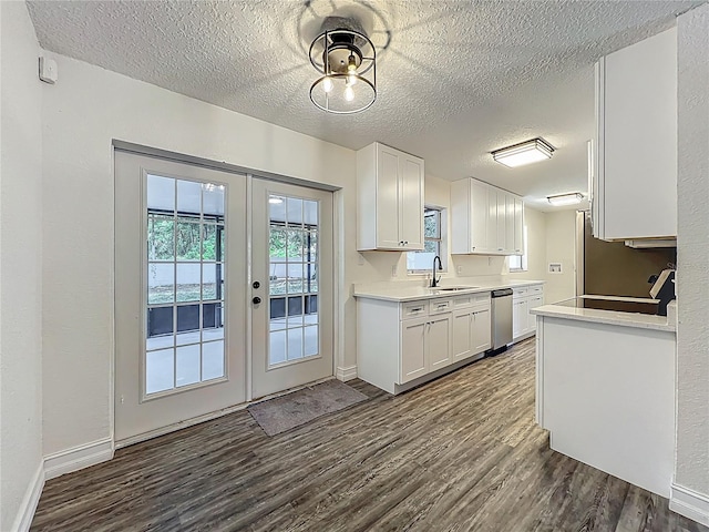 2109 Hartwell Ave, Sanford, FL 32771 - kitchen with stainless steel dishwasher, french doors, a textured ceiling, dark wood finished floors, and white cabinetry