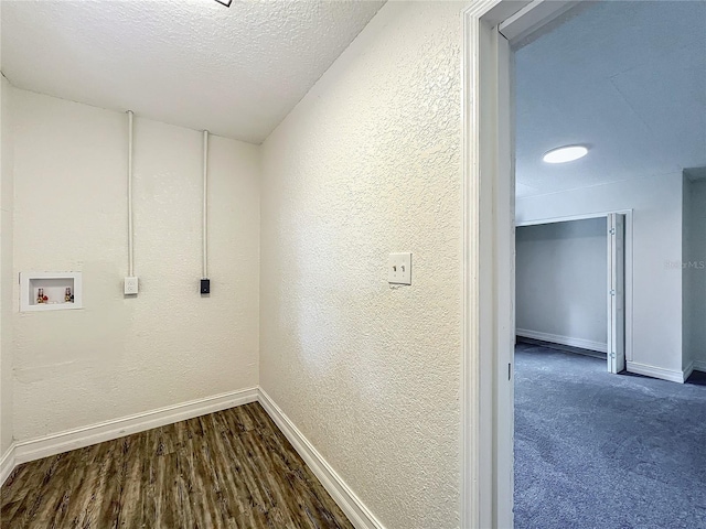 2109 Hartwell Ave, Sanford, FL 32771 - laundry area featuring hookup for a washing machine, a textured wall, dark wood finished floors, and a textured ceiling