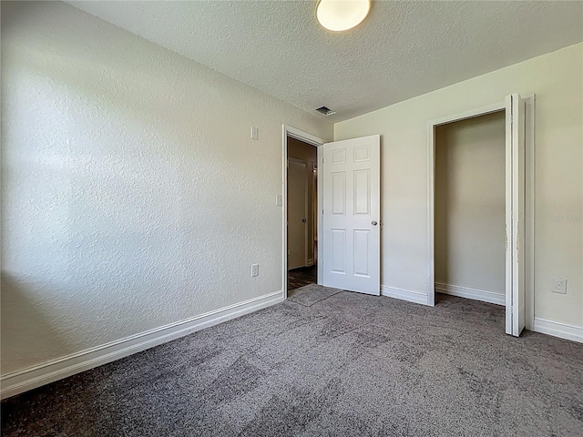 2109 Hartwell Ave, Sanford, FL 32771 - unfurnished bedroom with carpet flooring and a textured ceiling