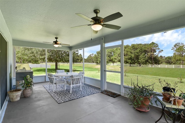 189 Blackstone Creek Rd, Groveland, FL 34736 - sunroom featuring ceiling fan and outdoor dining space