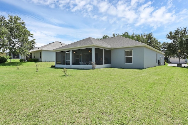 189 Blackstone Creek Rd, Groveland, FL 34736 - rear view of property featuring a sunroom, a yard, a shingled roof, and stucco siding