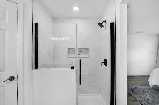 189 Blackstone Creek Rd, Groveland, FL 34736 - full bath with a marble finish shower, recessed lighting, and wood finished floors