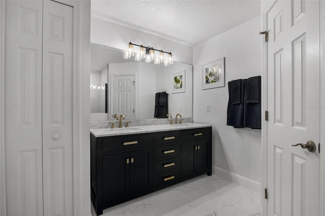 189 Blackstone Creek Rd, Groveland, FL 34736 - full bathroom featuring a closet, double vanity, marble look tile flooring, and a textured ceiling