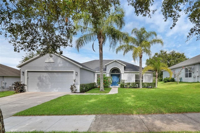 189 Blackstone Creek Rd, Groveland, FL 34736 - ranch-style house featuring a garage, stucco siding, driveway, and a front yard