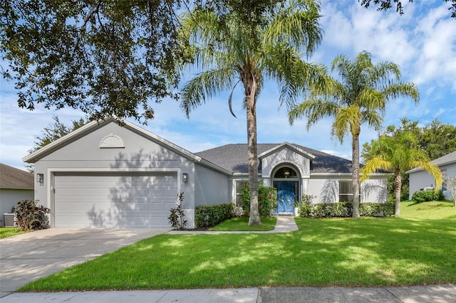 189 Blackstone Creek Rd, Groveland, FL 34736 - ranch-style house featuring stucco siding, an attached garage, driveway, and a front yard