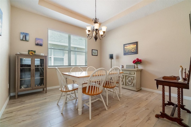 3896 Esplanade Ave, Port Orange, FL 32129 - dining room with light wood-style floors and a chandelier