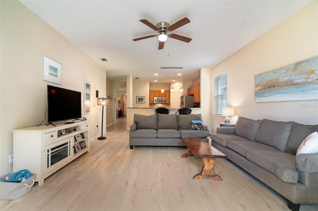 3896 Esplanade Ave, Port Orange, FL 32129 - living area with a ceiling fan and light wood-type flooring