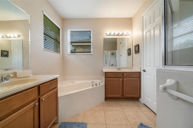 3896 Esplanade Ave, Port Orange, FL 32129 - bathroom with a shower stall, a bath, two vanities, and tile patterned flooring