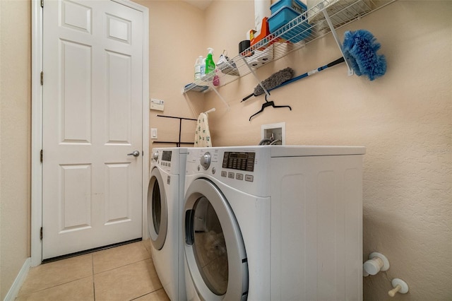 3896 Esplanade Ave, Port Orange, FL 32129 - washroom featuring washer and clothes dryer and light tile patterned floors