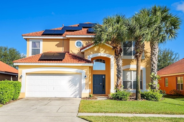 1428 Solana Cir, Davenport, FL 33897 - mediterranean / spanish-style home with solar panels, stucco siding, driveway, and a front yard