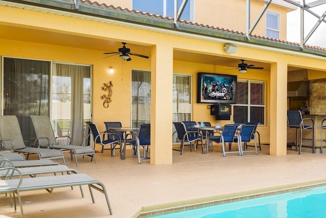 1428 Solana Cir, Davenport, FL 33897 - view of patio / terrace with a ceiling fan, glass enclosure, and an outdoor pool