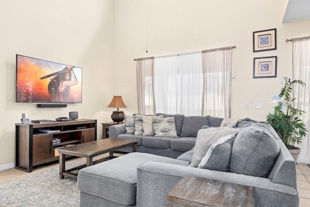 1428 Solana Cir, Davenport, FL 33897 - living room featuring a high ceiling and light tile patterned flooring
