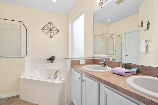 1428 Solana Cir, Davenport, FL 33897 - full bath featuring a garden tub, double vanity, a stall shower, and tile patterned flooring
