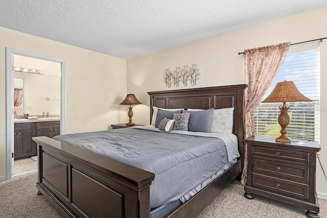 1428 Solana Cir, Davenport, FL 33897 - bedroom featuring light carpet, a textured ceiling, and connected bathroom