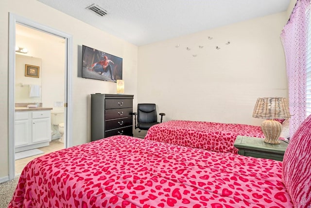 1428 Solana Cir, Davenport, FL 33897 - bedroom featuring ensuite bath and light carpet