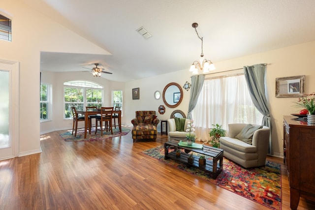 1646 Song Sparrow Ct, Sanford, FL 32773 - living area with a chandelier, wood finished floors, ceiling fan, and lofted ceiling