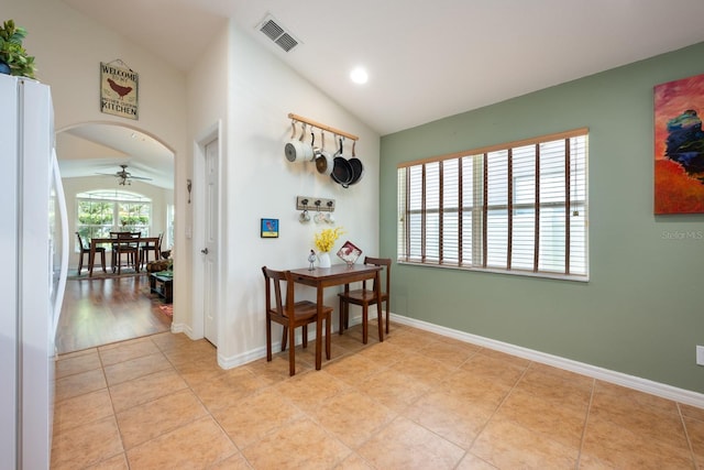 1646 Song Sparrow Ct, Sanford, FL 32773 - dining room featuring vaulted ceiling, ceiling fan, light tile patterned floors, arched walkways, and recessed lighting