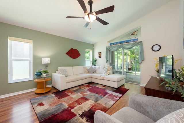 1646 Song Sparrow Ct, Sanford, FL 32773 - living area with vaulted ceiling, ceiling fan, and wood finished floors