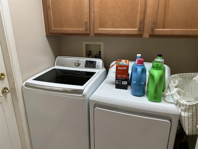 13000 Sandy Pine Ln, Clermont, FL 34711 - laundry area featuring independent washer and dryer and cabinet space