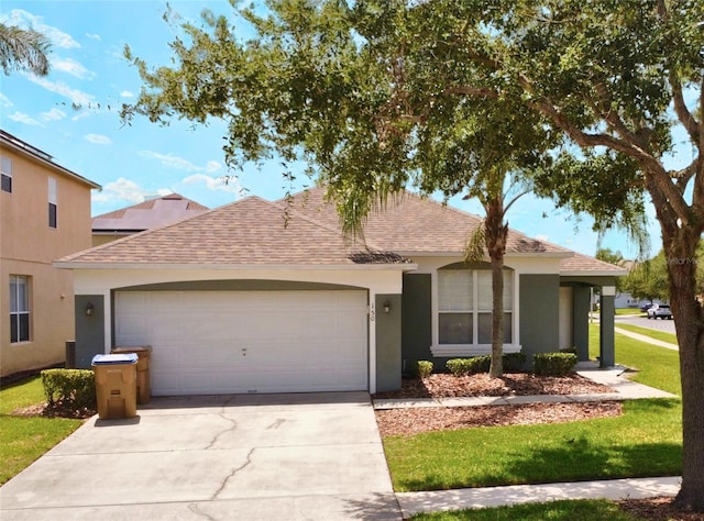 150 Barefoot Beach Way, Kissimmee, FL 34746 - single story home featuring roof with shingles, stucco siding, a garage, concrete driveway, and a front lawn