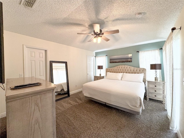 150 Barefoot Beach Way, Kissimmee, FL 34746 - carpeted bedroom with multiple windows, a textured ceiling, and ceiling fan