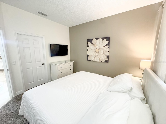 150 Barefoot Beach Way, Kissimmee, FL 34746 - carpeted bedroom featuring a textured ceiling
