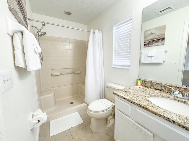 150 Barefoot Beach Way, Kissimmee, FL 34746 - full bathroom with vanity, tile patterned floors, tiled shower, a textured ceiling, and healthy amount of natural light