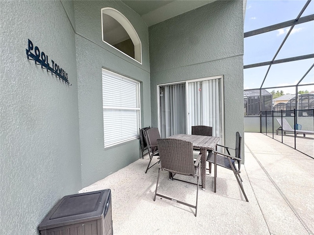 150 Barefoot Beach Way, Kissimmee, FL 34746 - view of patio / terrace featuring a lanai and outdoor dining area