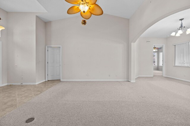 5339 Pond Crossing Pl, Leesburg, FL 34748 - carpeted spare room featuring ceiling fan, arched walkways, a chandelier, and high vaulted ceiling