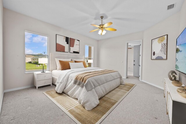 5339 Pond Crossing Pl, Leesburg, FL 34748 - bedroom featuring light colored carpet and a ceiling fan