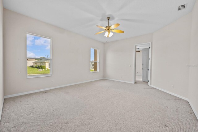 5339 Pond Crossing Pl, Leesburg, FL 34748 - unfurnished room featuring light carpet and a ceiling fan