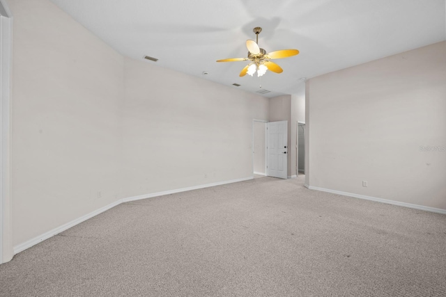 5339 Pond Crossing Pl, Leesburg, FL 34748 - spare room featuring light colored carpet and a ceiling fan