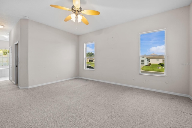 5339 Pond Crossing Pl, Leesburg, FL 34748 - unfurnished room featuring carpet, healthy amount of natural light, ceiling fan, and a smoke detector