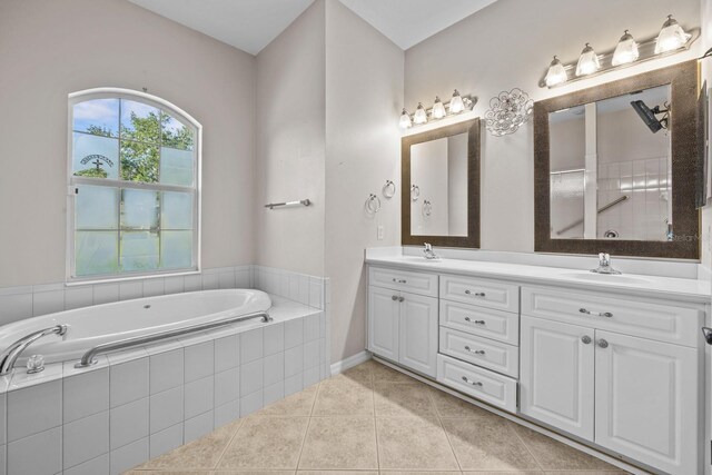 5339 Pond Crossing Pl, Leesburg, FL 34748 - bathroom featuring double vanity, a bath, and tile patterned flooring