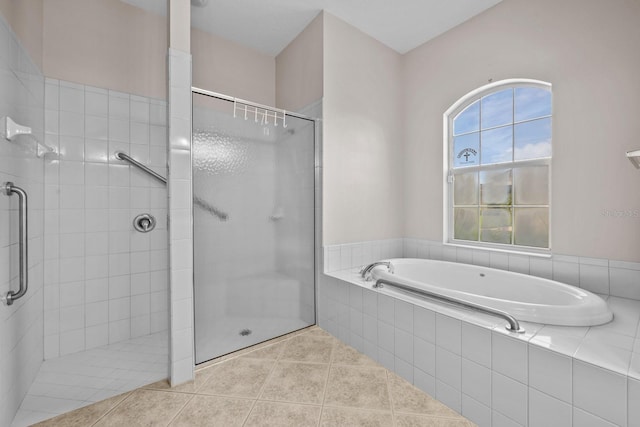 5339 Pond Crossing Pl, Leesburg, FL 34748 - bathroom with a stall shower, a garden tub, and tile patterned floors