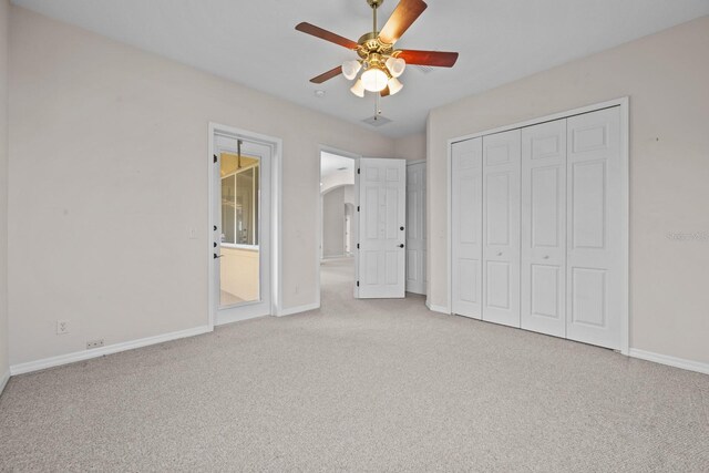 5339 Pond Crossing Pl, Leesburg, FL 34748 - unfurnished bedroom with carpet, a closet, and ceiling fan